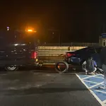 Mobile tyre fitter replacing a flat tyre at the roadside in London & the South East