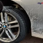 Mobile tyre fitter working on a car tyre in London & the South East